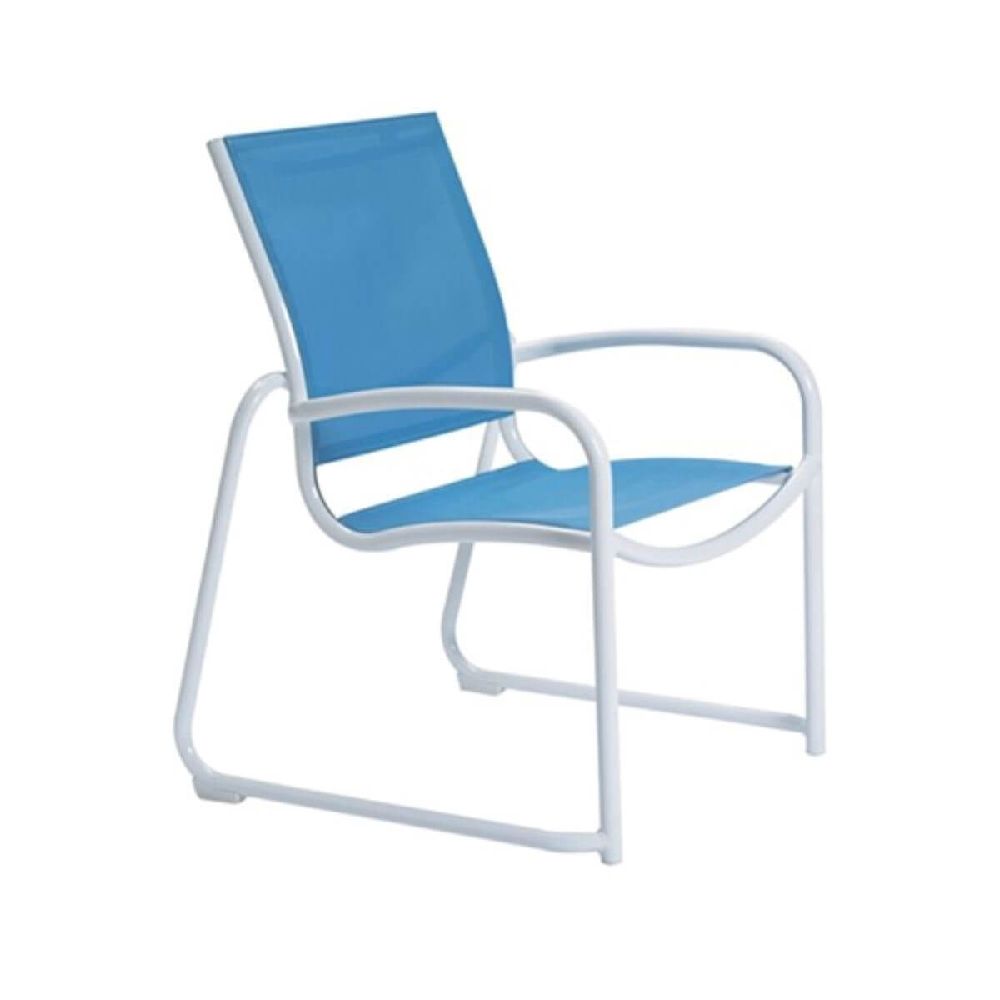 A Tropitone Millennia dining chair with a white aluminum frame and blue sling seat demonstrates lightweight, corrosion-resistant seating ideal for beach and poolside environments.